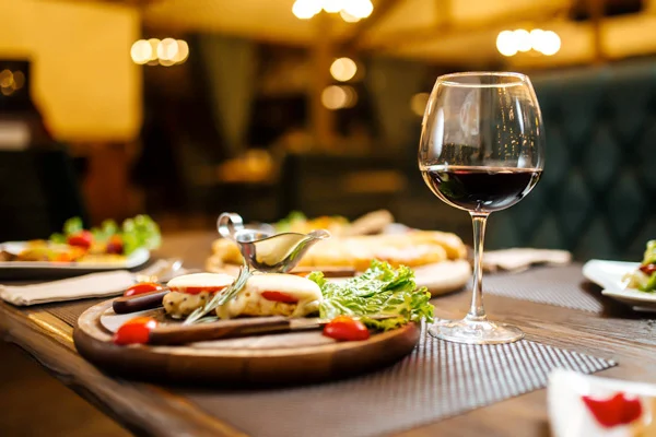 Restaurant Image with wine and plate of food